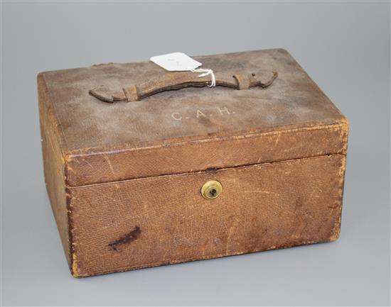 An Asprey of London leather jewellery box, with two interior trays and carrying handle, width, 25.4cm.